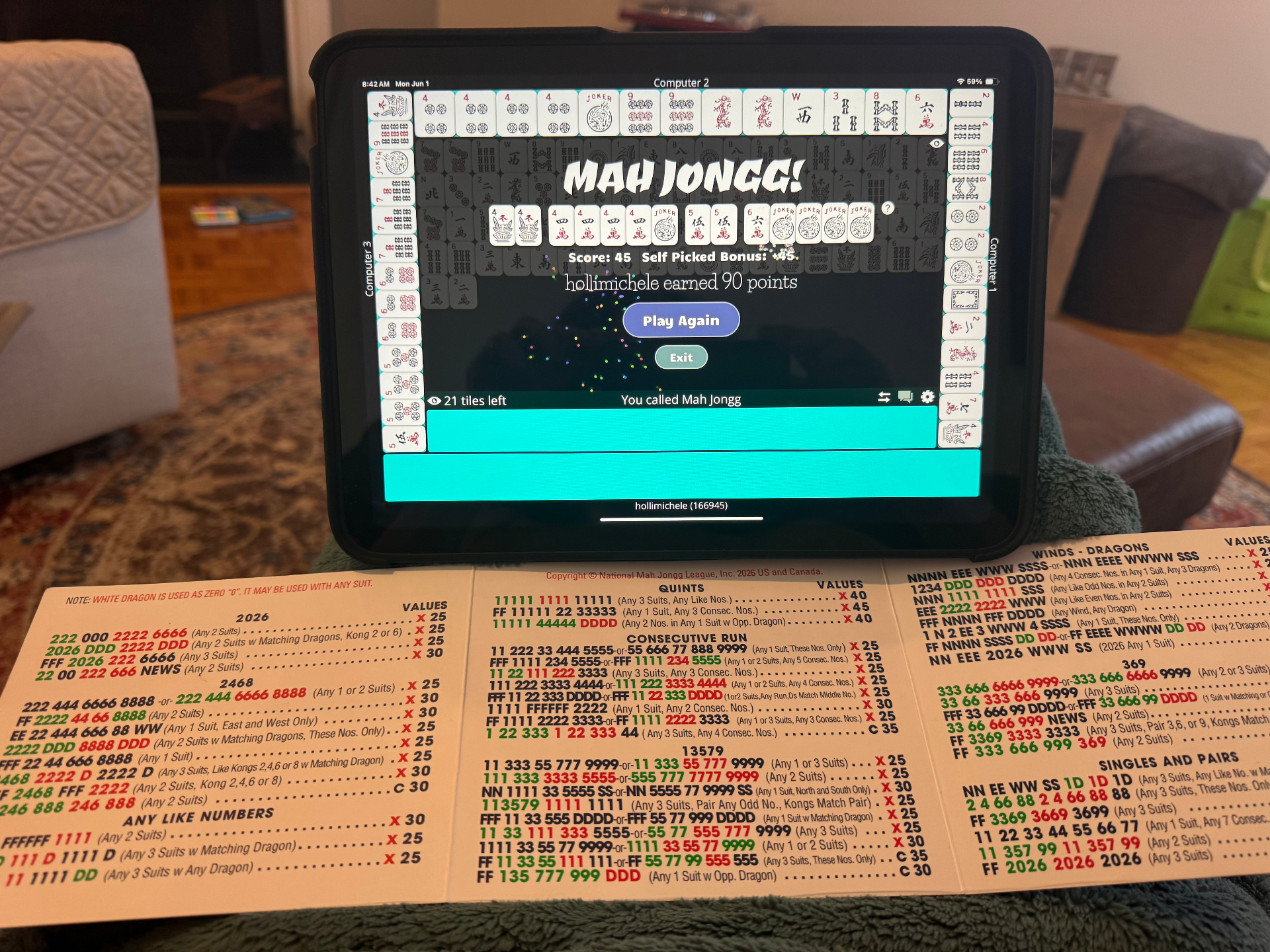 Holli's iPad showing a winning Mah Jongg hand next to a National Mah Jongg League card